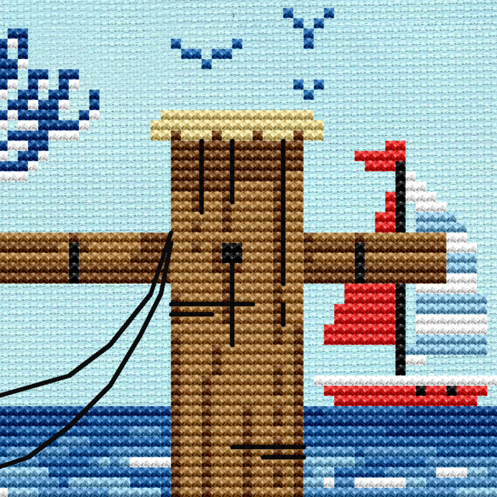 image of a pier post with a sailboat in the distance.